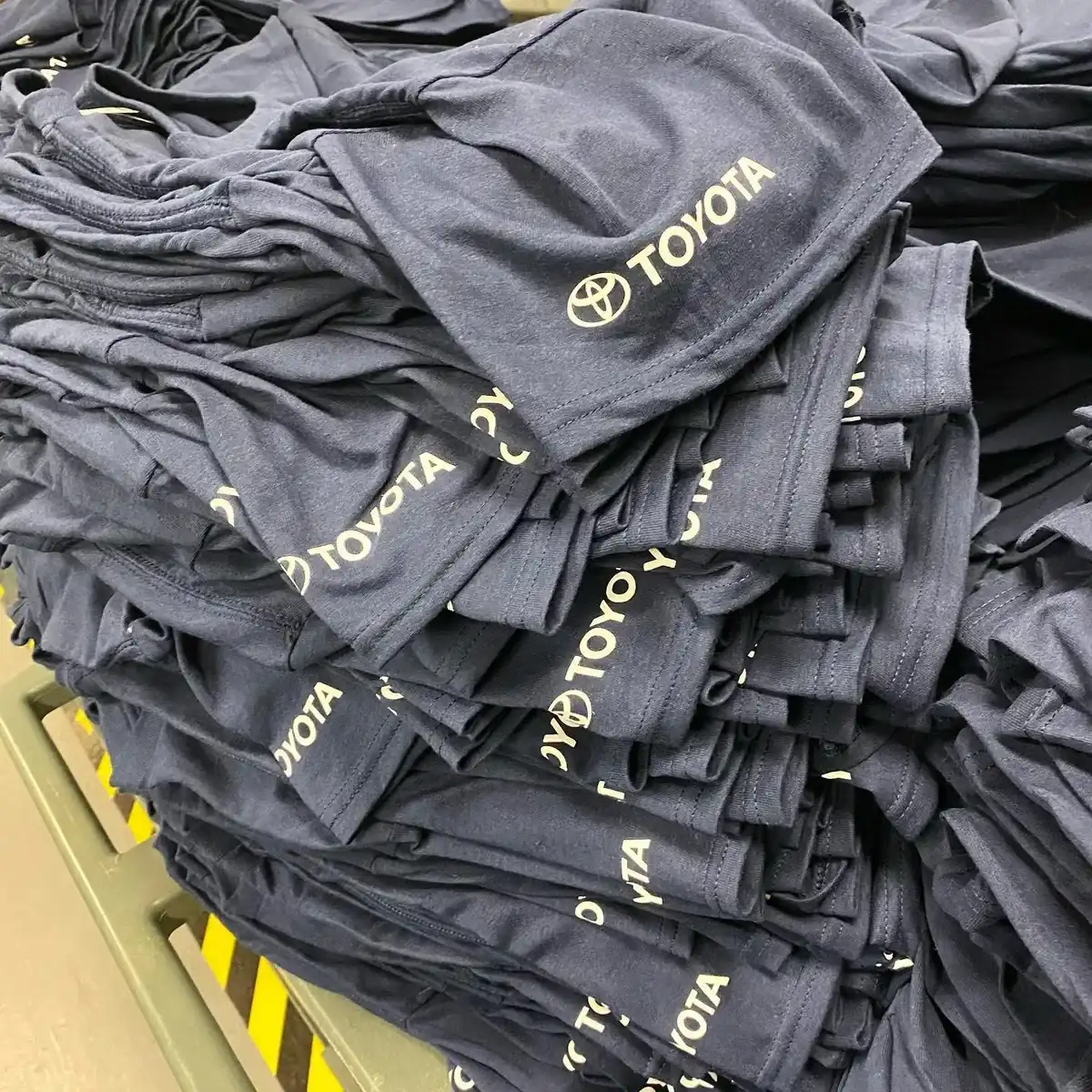 Bulk workwear t-shirt order with company logos — workwear printing Guildford