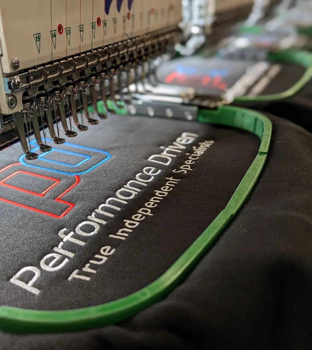 Custom embroidered workwear sample with company logo — embroidery services Guildford